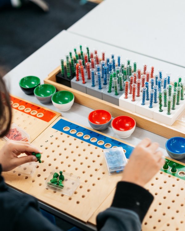 Girl with Montessori materials